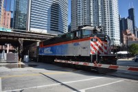 Metra 94, an ex-GO Transit F59PH, pushes a train into Union Station's north approach